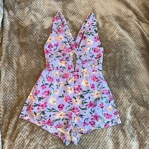 Millau LF Purple Floral Criss Cross Cutout Romper,  
Size XS.